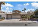 Charming home with a three-car garage and desert landscaping at 1508 Sun Copper Dr, Las Vegas, NV 89117