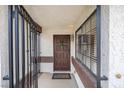 Welcoming front entry with decorative ironwork and a classic brown door at 1837 Alicant Way, Henderson, NV 89014