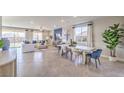Bright open-concept living room with modern decor and large windows at 1921 Lewis Bay Ave # Lot 21, North Las Vegas, NV 89084