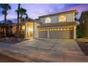 Well maintained two-story home with a three-car garage, tile roofing, and palm tree landscaping at 2445 Antler Point Dr, Henderson, NV 89074