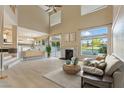 Inviting living room features a fireplace, large windows, and seamless access to outdoor spaces at 2445 Antler Point Dr, Henderson, NV 89074