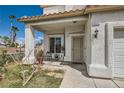 Welcoming front porch with stylish accents and a cozy seating area at 3332 Beca Faith Dr, North Las Vegas, NV 89032