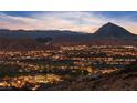Night aerial view of the community with a lake and mountain landscape at 35 Via Rizzuto, Henderson, NV 89011