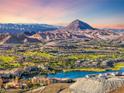 Panoramic aerial view of the community with a lake and mountain landscape at 35 Via Rizzuto, Henderson, NV 89011
