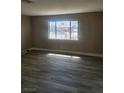 A naturally lit room with wood-style flooring and an exterior view at 4536 Payson Ave, Las Vegas, NV 89115
