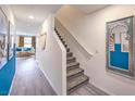 Inviting hallway with stairs leading to the upper level and a glimpse into the comfortable living area at 4828 Lilac Ridge Ave # 26, Las Vegas, NV 89141