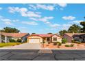 Charming one-story home featuring a two-car garage and desert landscaping at 5029 Pacific Grove Dr, Las Vegas, NV 89130