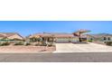 Expansive single-story home with a large driveway and RV parking at 5231 E Chasemoor St, Pahrump, NV 89061