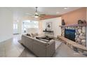 Inviting living room featuring a stone fireplace and a neutral color palette at 5231 E Chasemoor St, Pahrump, NV 89061
