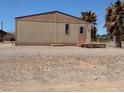 Side view of single-story home with small porch at 675 Stevens Ave, Overton, NV 89040