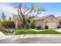 Charming single-story home with desert landscaping and a two-car garage in a residential neighborhood at 8912 Galena Crossing St, Las Vegas, NV 89123