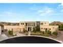 Contemporary home boasts inviting entrance, modern design, & desert landscaping at 9780 Solar Ave, Las Vegas, NV 89149