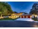 Gorgeous two-story home boasting a landscaped yard, inviting front facade, and spacious driveway at 1 Quail Run Rd, Henderson, NV 89014