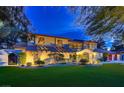 Charming two-story home showcasing a beautiful exterior, manicured lawn, and mature landscaping at 1 Quail Run Rd, Henderson, NV 89014