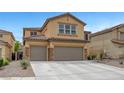 Inviting two-story home with a charming facade and a spacious three car driveway at 1547 Harwood Ave, Henderson, NV 89012