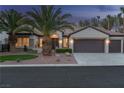 Well-maintained single-story home with a three-car garage and mature landscaping at 1624 Preston Park Dr, Henderson, NV 89052