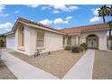 Lovely single-story home featuring a tile roof and a well-maintained desert landscape at 1830 Ginger Blossom Ave, North Las Vegas, NV 89031