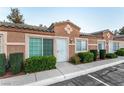 Street view showing townhome with well-maintained front yard and accessible parking at 2110 Sleepy Ct, Las Vegas, NV 89106