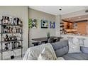 Cozy living area featuring a dining space, full bar, and adjacent open kitchen at 222 Karen Ave # 1804, Las Vegas, NV 89109