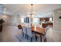 Open floor plan features a modern dining area and a brick accent wall at 2510 Verdello St, Henderson, NV 89044
