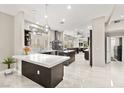 Open concept kitchen with large island, marble floors, modern appliances, and sleek cabinetry at 2608 Sun Reef Rd, Las Vegas, NV 89128