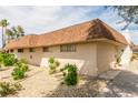 View of the home's exterior with low maintenance desert landscaping and a brick chimney on a sunny day at 2645 Heritage Ct, Las Vegas, NV 89121