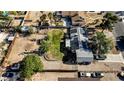 Aerial shot of home with solar panels, green lawn, and spacious lot, offering energy efficiency at 3100 Garehime St, Las Vegas, NV 89108