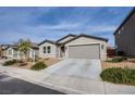 Inviting single-story home with a well-maintained yard and a convenient two-car garage at 380 Horsetail Falls St, Indian Springs, NV 89018