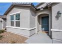 Close-up of the front door and window showcasing the home's architectural details at 380 Horsetail Falls St, Indian Springs, NV 89018