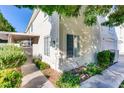 Exterior angle of home featuring a gated entrance and landscaping at 447 Temple Canyon Pl, Henderson, NV 89074