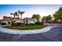 Charming single-story home at dusk boasting a lush lawn, mature landscaping, and delightful curb appeal at 4517 Inez Dr, Las Vegas, NV 89130