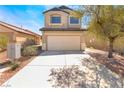 Front exterior view of home with concrete driveway and low-maintenance landscaping at 6405 Strongbow Dr, Las Vegas, NV 89156