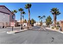 Gated community entrance with palm trees and lush landscaping at , Las Vegas, NV 89118
