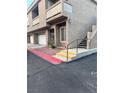 Exterior shot of the condo showing attached garage and stairs to the front door at , Las Vegas, NV 89118