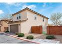 Lovely two-story home with a brick surround, desert landscaping, and a secure gated area in the backyard at 10943 Ketchikan St, Las Vegas, NV 89179