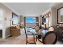 Living room featuring a glass dining table, sleeper sofa and amazing views of the city at 125 E Harmon Ave # 2220, Las Vegas, NV 89109
