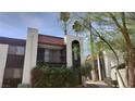 Charming apartment building with a balcony and mature landscaping, creating a serene outdoor space at 1405 Vegas Valley Dr # 114, Las Vegas, NV 89169