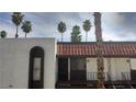Charming condo with private balcony, dark trim, and an entryway that is both stylish and practical at 1405 Vegas Valley Dr # 114, Las Vegas, NV 89169
