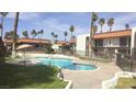 Inviting pool area with comfortable seating, lush landscaping, and a relaxing atmosphere at 1405 Vegas Valley Dr # 114, Las Vegas, NV 89169