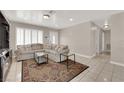 Inviting living room featuring tile floors, recessed lighting, and bright natural light at 1813 Constantine Ave, Las Vegas, NV 89101