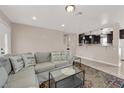 Comfortable living room with stylish decor, opening to the kitchen and dining area at 1813 Constantine Ave, Las Vegas, NV 89101