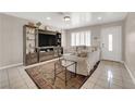 Inviting living room featuring tile floors, recessed lighting, and bright natural light at 1813 Constantine Ave, Las Vegas, NV 89101