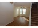Bright living room with hardwood floors, ceiling fan and staircase at 2520 Living Rock St, Las Vegas, NV 89106