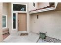 Welcoming front entrance featuring a stylish door, decorative window, and neutral-toned exterior at 2908 Reef Bay Ln, Las Vegas, NV 89128