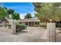 Long driveway leading to a beautiful home, framed by decorative brick pillars at 3015 Duneville St, Las Vegas, NV 89146