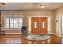 Inviting entryway features double doors, stone accents, and hardwood floors at 3015 Duneville St, Las Vegas, NV 89146
