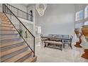 Bright dining room featuring modern chandelier and staircase at 3257 Coral Harbor Dr, Las Vegas, NV 89117