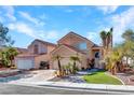 Charming home featuring a two-car garage and manicured landscaping at 3257 Coral Harbor Dr, Las Vegas, NV 89117