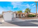 Charming single-story home featuring a two car garage and desert landscaping with mature palms at 3661 Margarita Way, Las Vegas, NV 89103