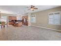 Spacious open-concept living space features large windows, tile floors and neutral decor at 519 Via Garofano Ave, Henderson, NV 89011